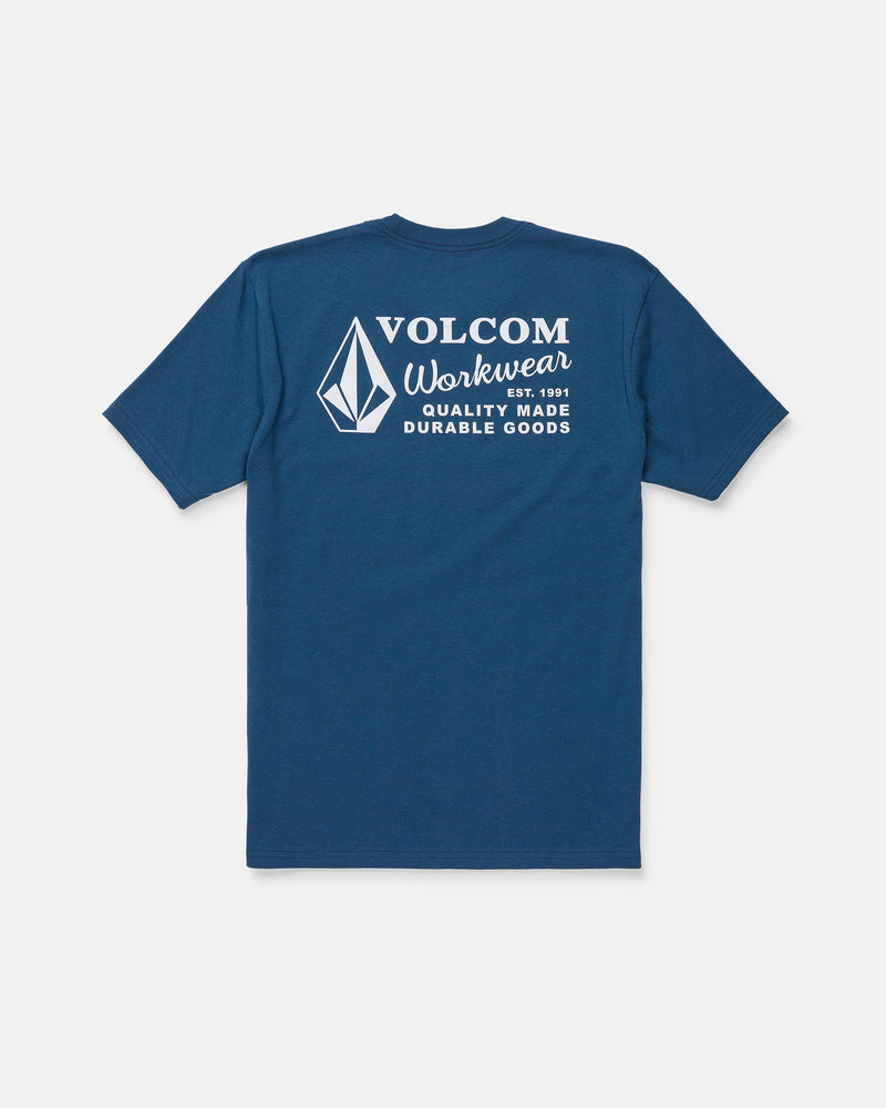 The Men's Volcom Workwear Short Sleeve Tee by Volcom is featured in blue, displayed from the back with a white diamond emblem and logo. The upper back showcases the text “Volcom Workwear, Quality Made Durable Goods.” Crafted from heavy-weight cotton, this classic fit tee is designed for long-lasting comfort and durability.