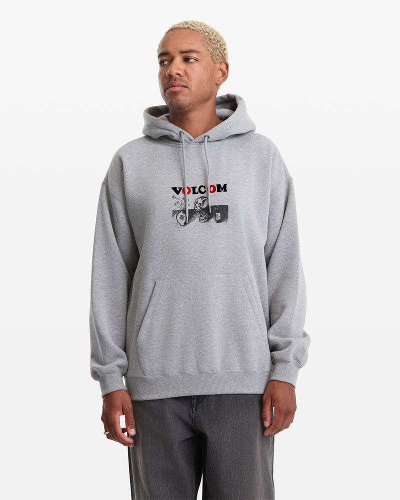 A man wears the Volcom Men's Featured Artist Seth Conboy Pullover, a light gray hoodie with a front pocket and red VOLCOM graphic on the chest, standing against a plain white background.