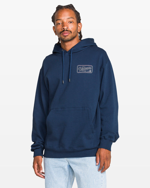 Man wearing a navy blue hoodie with a logo on a white background
