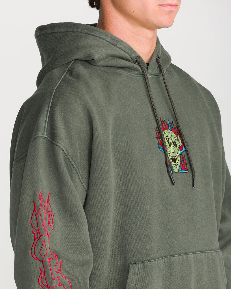 Volcom Men’s Featured Artist Casey Jones Pullover in olive green, featuring a chest graphic of a screaming face surrounded by flames and red flame embroidery on the sleeve.