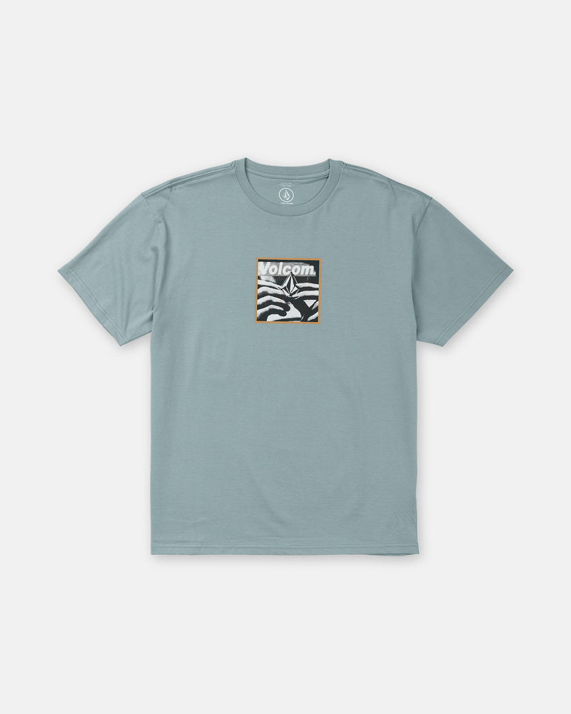 Volcom Men’s Hand Held Short Sleeve Tee in muted blue, featuring a loose-fit, short-sleeve crewneck cut and a rectangular chest graphic of a stylized hand with brand text.