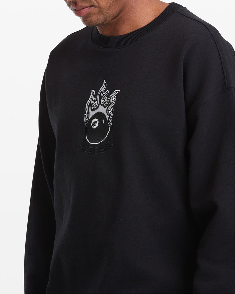 A man wears the Volcom Men's Featured Artist Seth Conboy Crew—a black fleece sweatshirt with a flaming vinyl record graphic and "RECORDS" embroidered below. Only his lower face and upper torso are visible.
