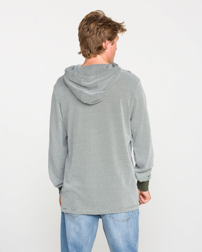 A person with light brown hair, wearing the Volcom Men's Rowan Thermal Long Sleeve Shirt in light gray and blue jeans, is standing facing away from the camera against a plain white background.