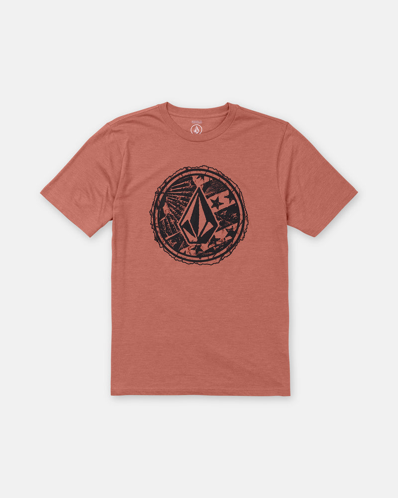 The Men’s Core Stone Short Sleeve Tee by Volcom is a rust modern-fit crew neck with short sleeves and a large black abstract geometric logo in a distressed circular border on the chest.