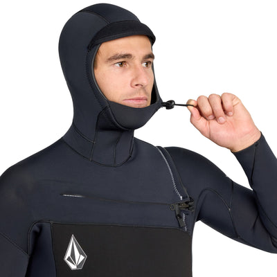 Person wearing a black wetsuit with a brand logo on a white background