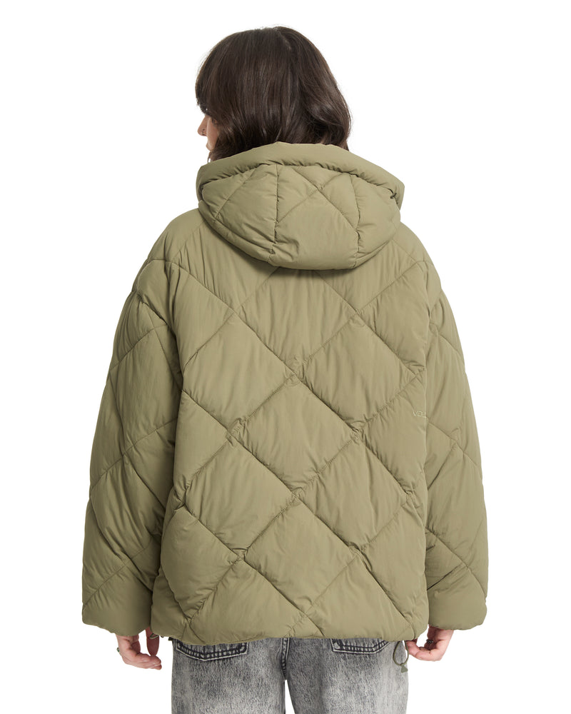A person wearing an olive green, heavyweight, quilted, hooded Out Of Boxy Puff puffer jacket by Volcom.