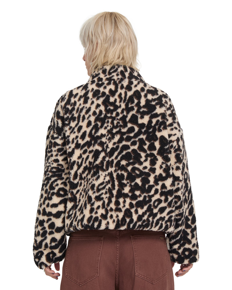Back view of a person wearing an oversized, fuzzy leopard-print Volcom Wylding Out Sherpa jacket.
