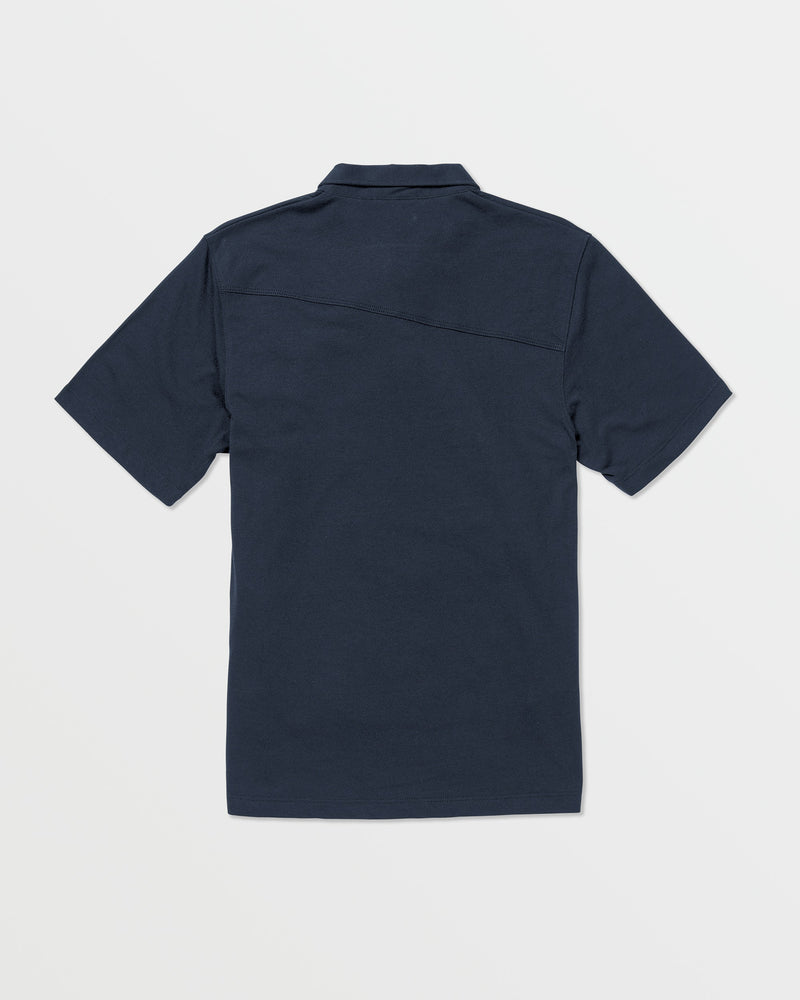 The Volcom Kids' Wowzer Polo Short Sleeve Tee is a navy blue modern fit shirt, shown from the back and laid flat on a white background. Made from a comfortable cotton-poly blend.