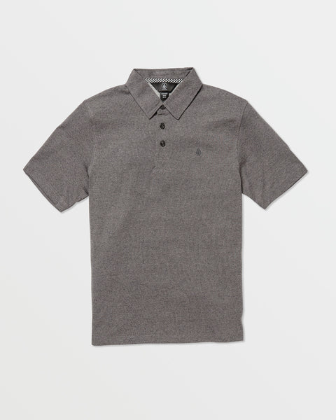 The Volcom Kids' Wowzer Polo Short Sleeve Tee in heather gray features a modern fit, collar, three buttons, and a small embroidered logo on the left chest. It's made from a comfy cotton-poly blend and shown flat on a white background.