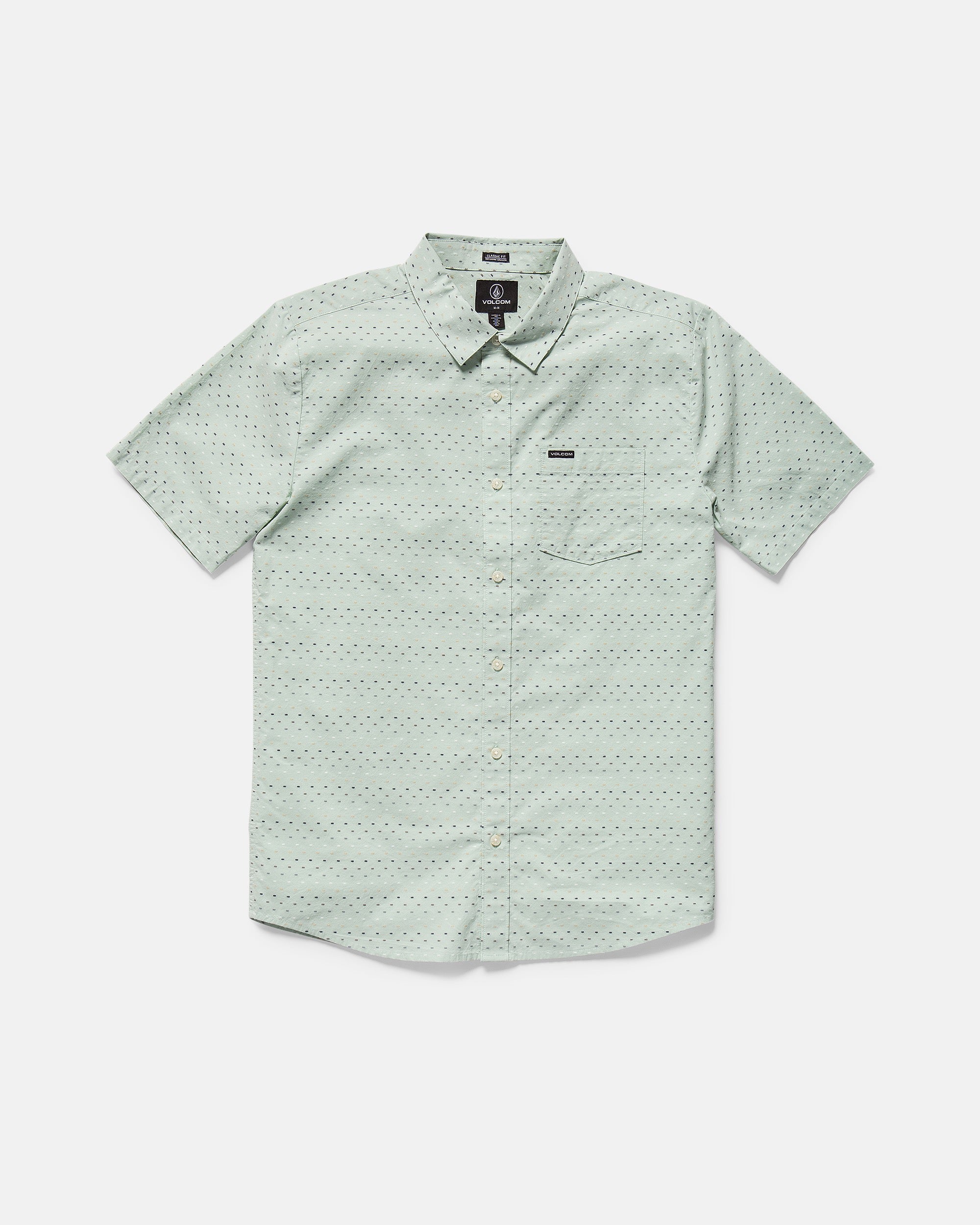 The Men's Bankstone II Short Sleeve Tee by Volcom features a light green color, classic fit, crew neck, and single chest pocket. This textured tee is laid flat on a white background.