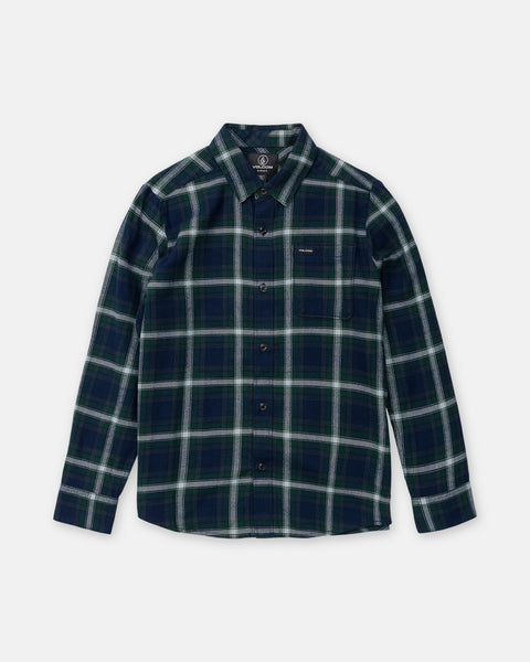 Volcom Boy’s Caden Plaid Long Sleeve classic fit button-down shirt in a navy, green, and white plaid pattern with a single chest pocket.