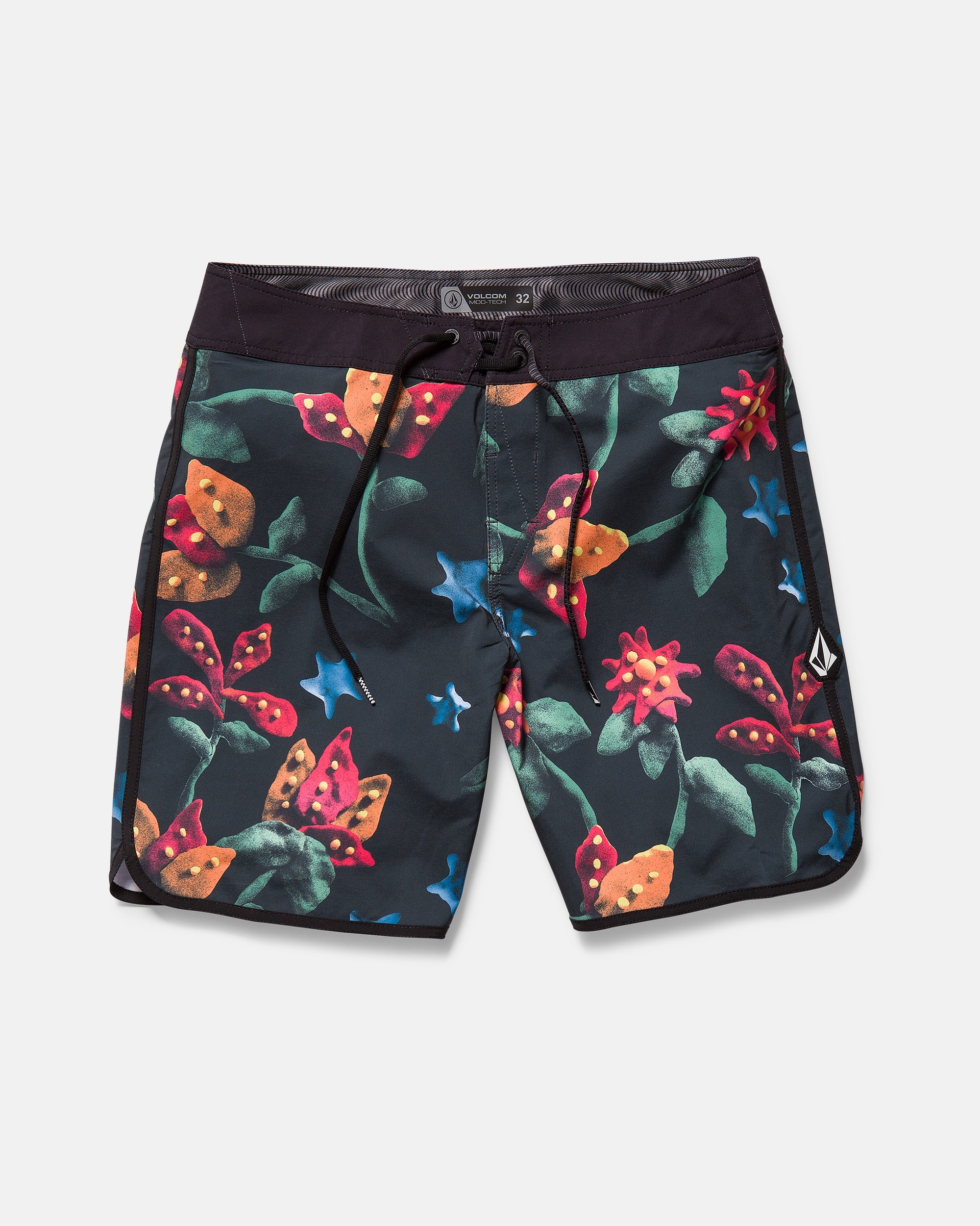 The Volcom Kids' Big Boys' Infuse Scallop Mod features black boardshorts with a tropical floral print, Cinch Fly Technology, a black drawstring waistband, and a small Volcom logo patch on the right leg.