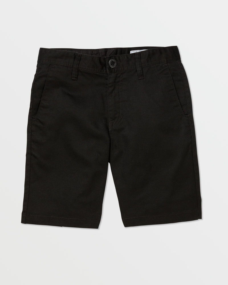 A pair of black Volcom Kids' Frickin Chino Shorts 16" with a modern fit, front pockets, belt loops, and a button closure is laid flat on a white background.
