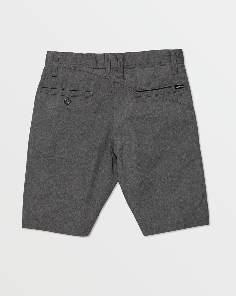 Back view of Volcom Kids' Big Boys' Frickin Chino Shorts with belt loops, two back pockets (one buttoned), and a black label above the right pocket, shown on a white background.