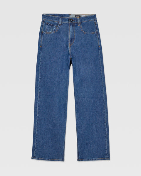 The Volcom Kids' Billow Denim II Pants are medium wash jeans featuring a straight leg, classic five-pocket style, and button-zip closure, shown laid flat on a white background.