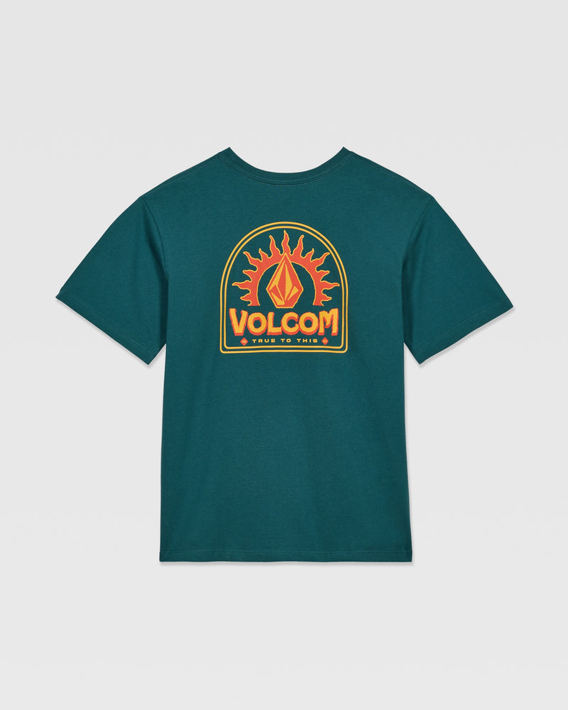 The Kids' Solstice Short Sleeve Tee by Volcom features a dark teal color and a bold back graphic with a stylized flame and “VOLCOM” in orange-yellow above “TRUE TO THIS”—perfect to pair with your favorite Volcom denim or low-rise jeans.
