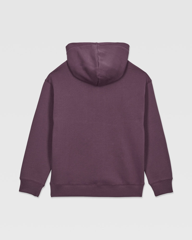 The Volcom Kids' Watanite Pullover is a plain, dark purple hoodie for boys, shown from the back. It features heavyweight fleece, a hood, long sleeves, and ribbed cuffs and waistband with no visible logos or designs.