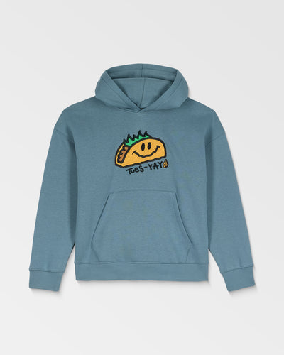 The Volcom Kids' Voltaco Po is a blue hoodie with a graphic of a smiling taco with green toppings and “Tues-Yay!” on the front. It features a front pocket and an adjustable hood with drawstrings.