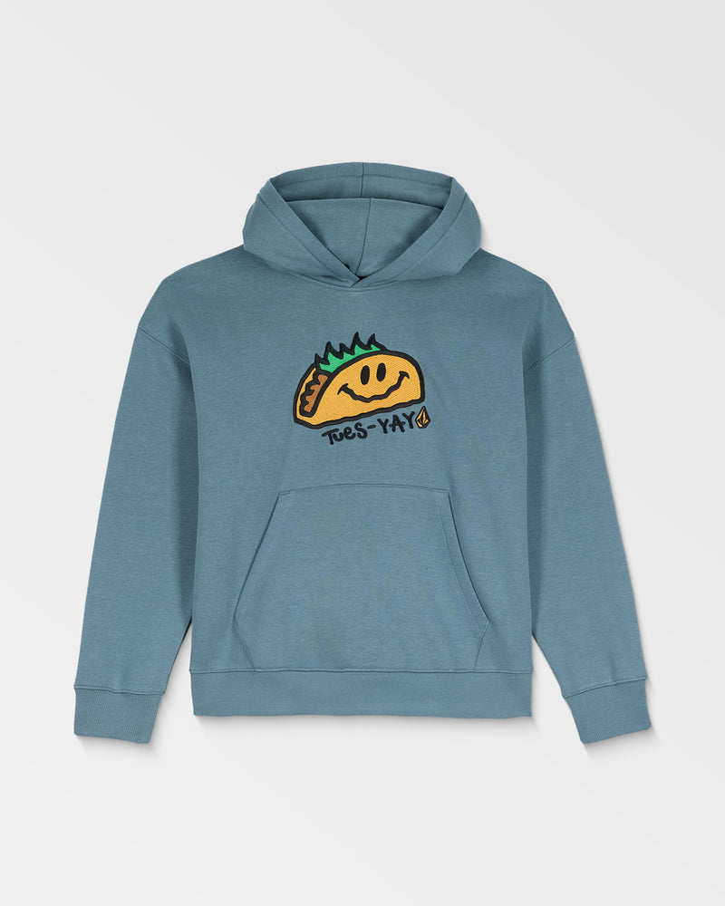 The Volcom Kids' Voltaco Po is a blue hoodie with a graphic of a smiling taco with green toppings and “Tues-Yay!” on the front. It features a front pocket and an adjustable hood with drawstrings.