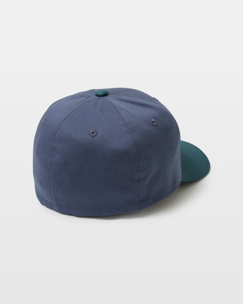 The Men's Full Stone Flexfit Hat by Volcom, featuring a blue crown with a green brim and top button, is displayed from the back against a plain white background.
