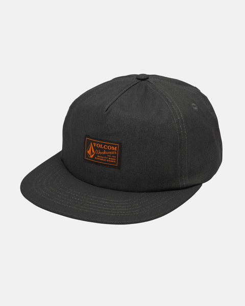 The Men's Workwear Adjustable Hat by Volcom features black washed canvas, a flat brim, and a brown front patch with the Volcom logo and text, offering a cotton workwear-inspired look.