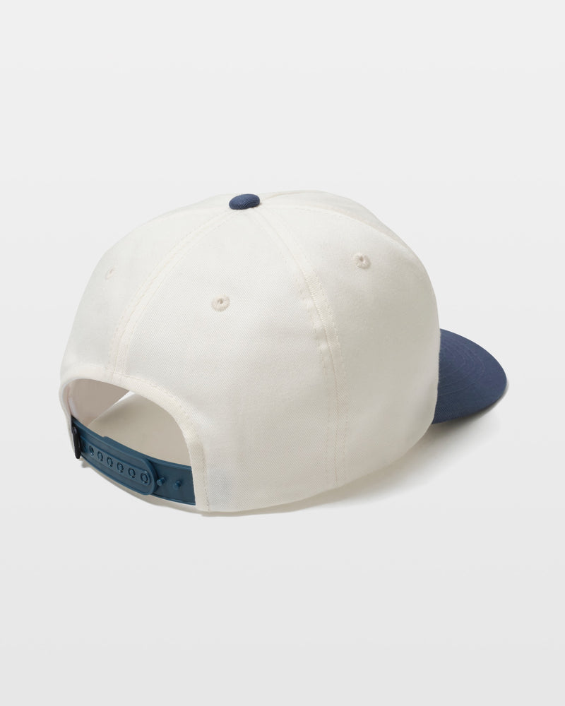 The Volcom Men's Petrolstone Adj Hat is a white baseball cap with a navy blue brim and blue adjustable snapback closure, shown from the back and side on a plain white background.