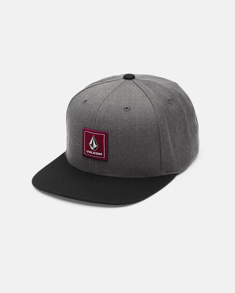 The Men's Quarter Evo Twill by Volcom is a gray cotton twill snapback hat featuring a black brim and a maroon square Volcom logo patch on the front panel, displayed against a plain white background.