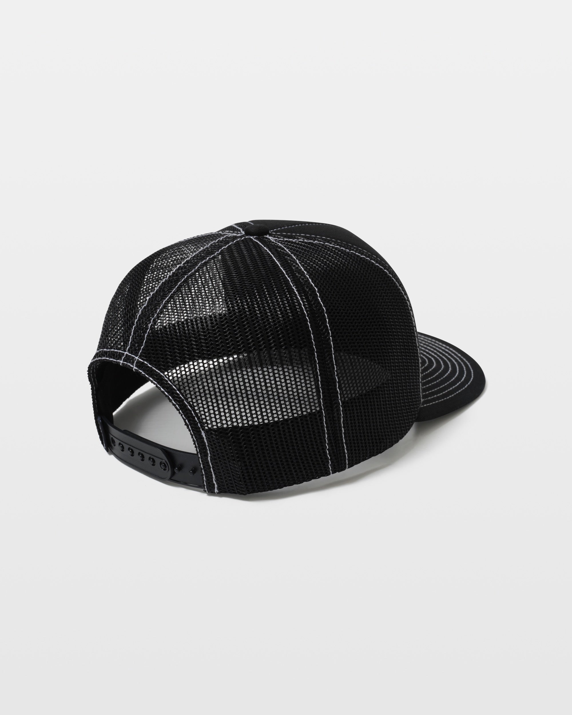 The Volcom Men's Over The Falls Cheese trucker hat is black with white stitching, a curved bill, and mesh back. It features a snapback closure and is shown from the back against a plain white background.