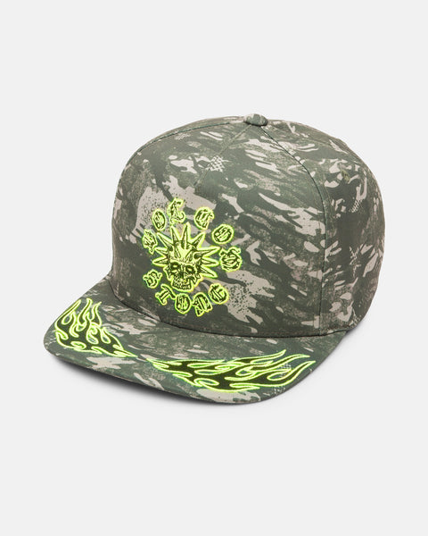 The Volcom Men's Beast Mode Adjustable Hat features green and gray camo, graphic embroidery of a neon yellow skull with symbols on the front, plus sublimated neon yellow flame designs on the brim.