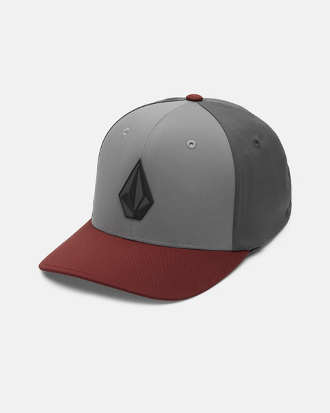 A Volcom Men's Stone Tech Flexfit Delta Hat in gray and maroon, featuring a black geometric logo on the front, displayed on a white background.
