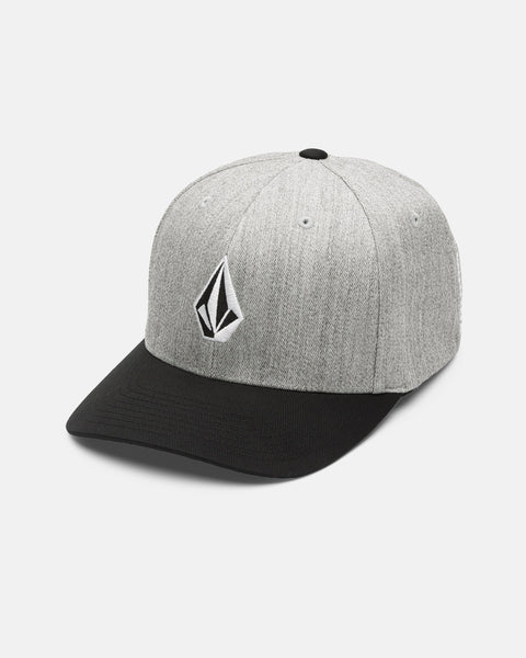 The Volcom Men's Full Stone Heather Flexfit Hat, shown against a white background, features a gray structured stretch twill design with a black brim and is finished with a black-and-white geometric Volcom logo on the front.