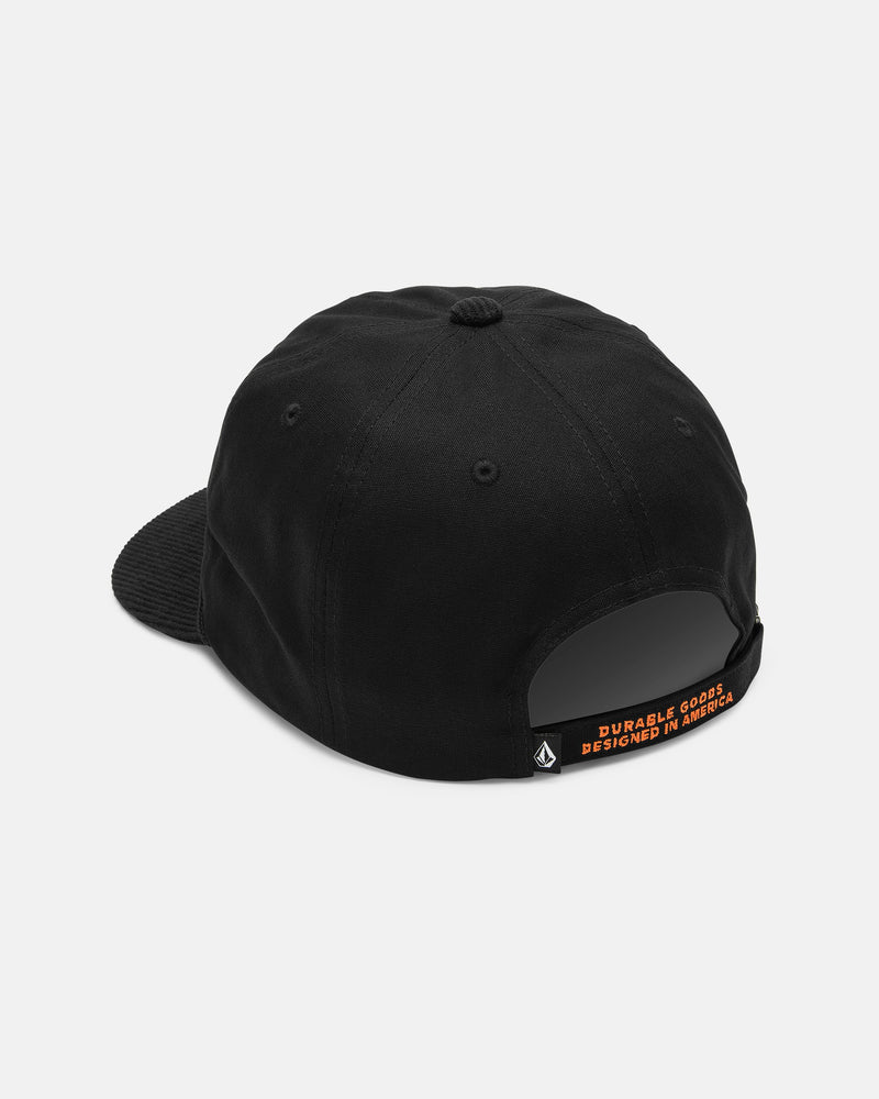 A rear view of the Volcom Men's Stone Talon Workwear Hat—a black canvas 5-panel baseball cap—shows its fabric strap, which is accented by a small orange tag with the text "DURABLE GOODS DESIGNED IN AMERICA" in capital letters.