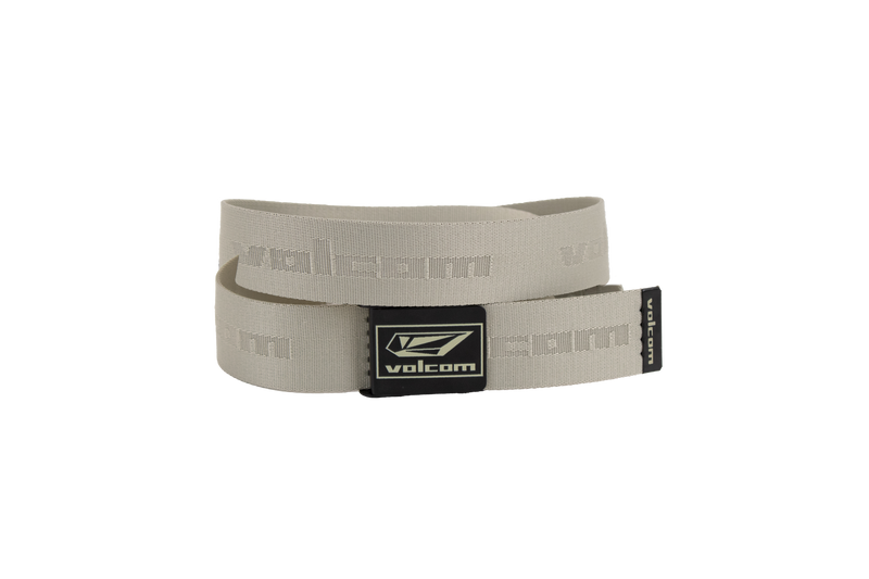 The Volcom Men's Modstone Web Belt is a beige belt with a metal clamp buckle featuring the Volcom logo, embossed "volcom" text repeating along the strap, and a hidden opener inside the buckle for added convenience.
