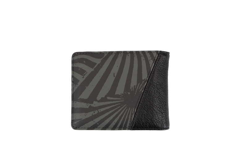 The Volcom Men's Solidstone Bifold wallet features an abstract striped pattern in black and gray with a textured black leather corner, displayed against a plain white background.