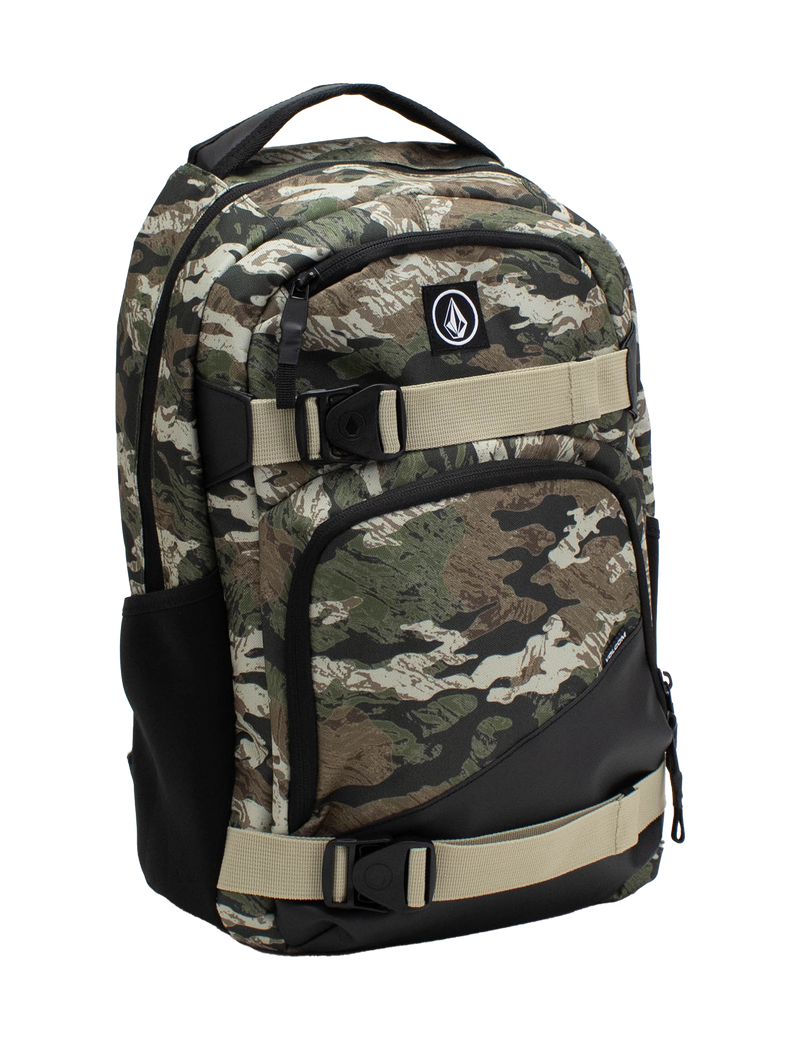 The Volcom Men's Grindstone Skate Backpack features a camo pattern with beige adjustable straps, a black bottom, multiple compartments, a dedicated laptop sleeve, and a front logo patch, shown against a white background.