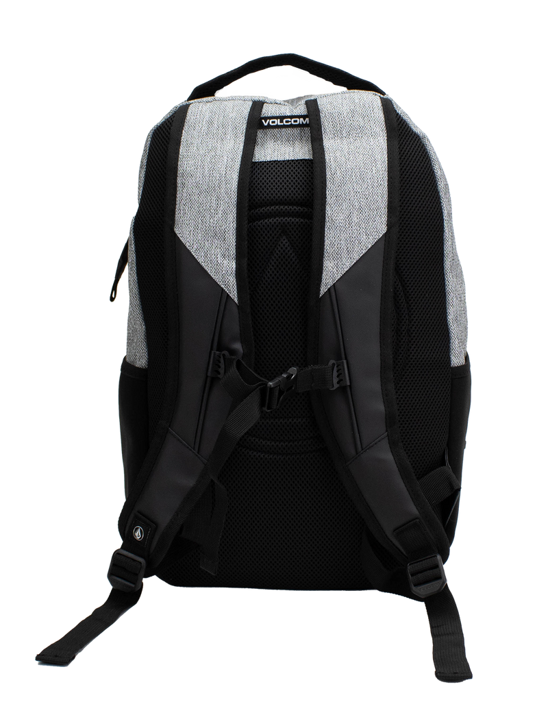 A back view of the Volcom Men's Grindstone Skate Backpack in gray and black, displaying padded shoulder straps, adjustable straps, a top handle, side mesh pockets, a padded laptop sleeve, and an adjustable chest strap against a white background.
