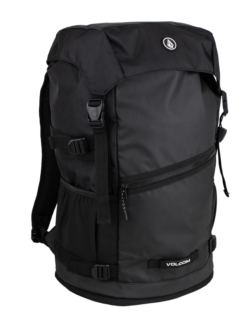 The Volcom Men's Litestone Gear Pack is a durable backpack with multiple compartments, side mesh pockets, adjustable straps, and a zippered front pocket, shown on a white background.