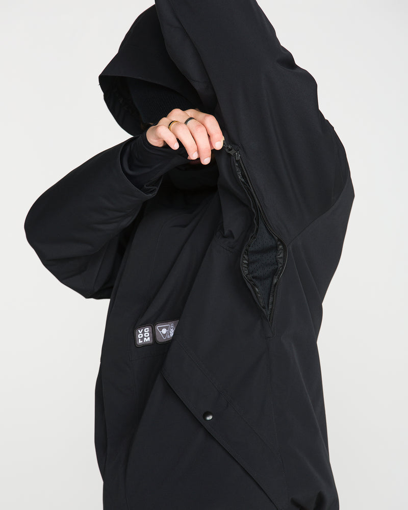 A person wearing the Volcom Men’s Double Insulated Jacket lifts their arm to display a zippered underarm vent with a mesh lining inside. Their face is mostly obscured.