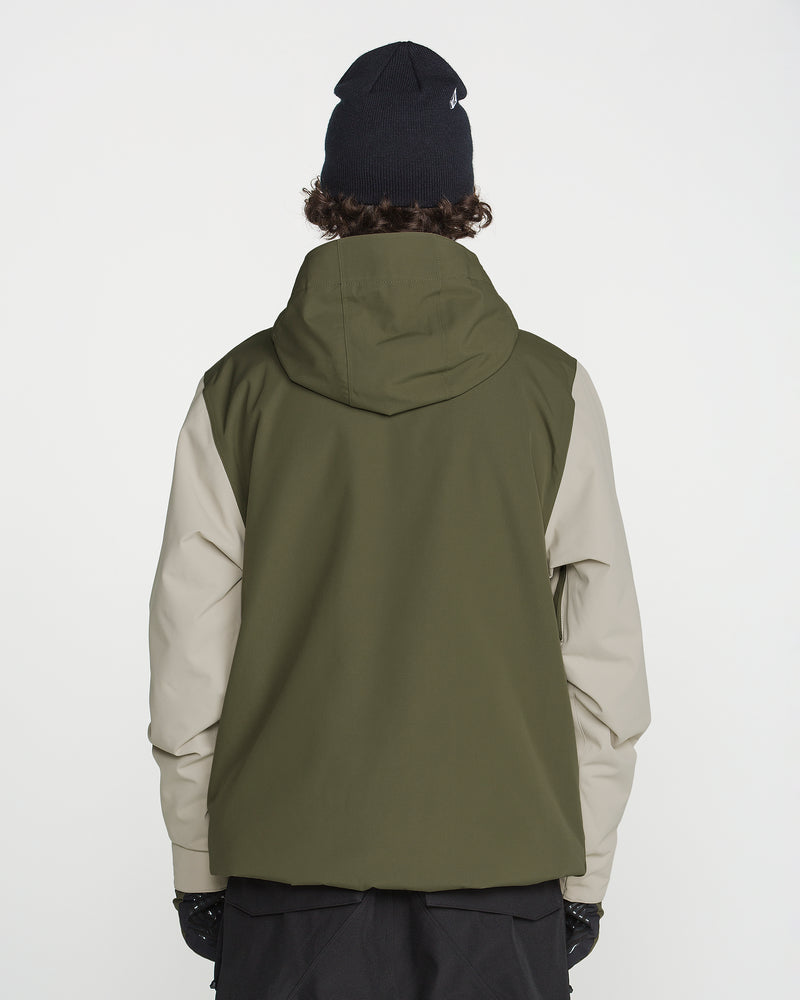 A person wearing the Volcom Men’s Double Insulated Jacket in green and beige, paired with black gloves and a black beanie, stands with their back to the camera against a plain white background.
