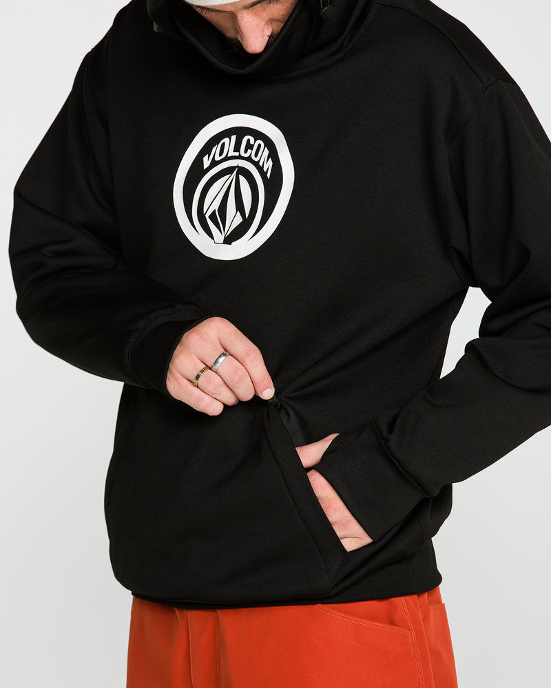 A person wearing the Volcom Men’s Hydro Riding Hoodie in black and orange pants is unzipping a side pocket. Only their mouth and lower face are visible, as their face is partially out of frame.