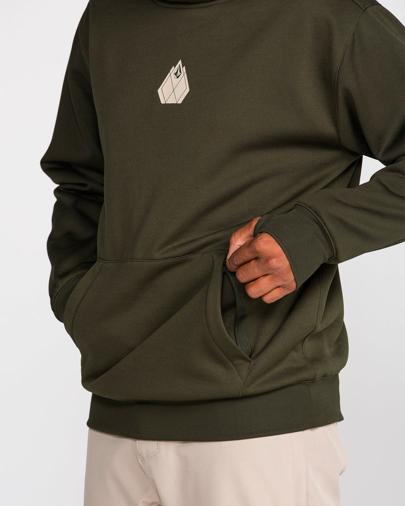A person wearing the Volcom Men’s Hydro Riding Hoodie in olive green, featuring a geometric design on the chest and paired with light beige pants, places their hand in the front pocket of the hoodie. The hydrophobic fleece material offers comfort and durability for everyday wear.