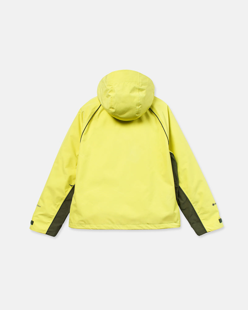 Unisex Yourfav Baggy Gore Jacket by Volcom in yellow with black side panels and long sleeves, displayed from the back against a plain white background.
