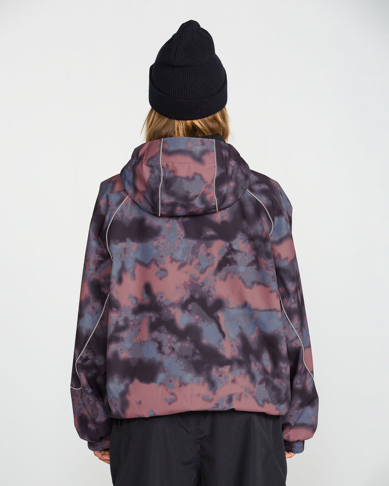 A person is shown from behind against a plain white background, wearing a black beanie and the Volcom Unisex Liftline 20K Jacket, featuring a baggy snowboard jacket style in a purple, pink, and black tie-dye pattern.