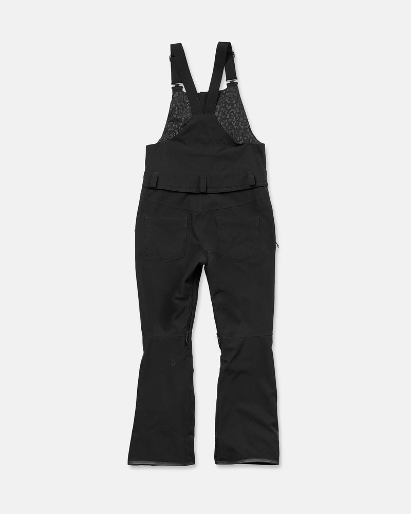 Volcom Women’s Swift Bib overall snow pants for Black women, made from recycled fabric with V-Science stretch, featuring adjustable shoulder straps, back pockets, and flared legs, displayed flat on a white background.