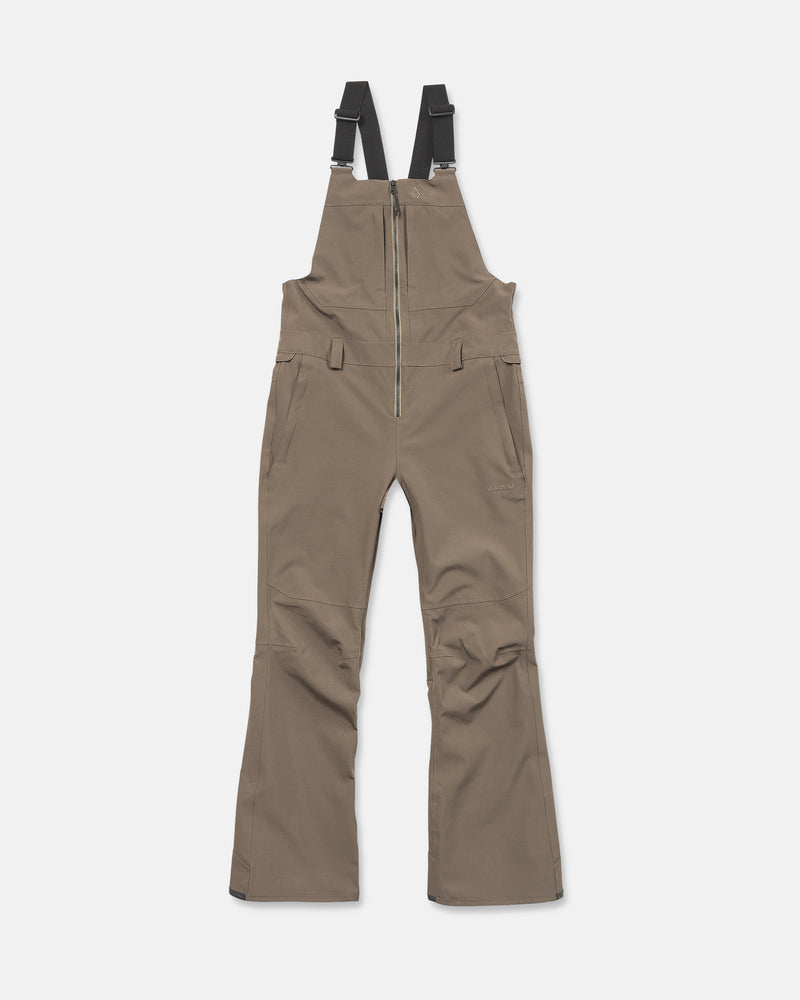The Volcom Women’s Swift Bib in brown is crafted from recycled fabric, featuring black adjustable shoulder straps, a front zipper closure, side pockets, and flared legs, displayed on a white background.