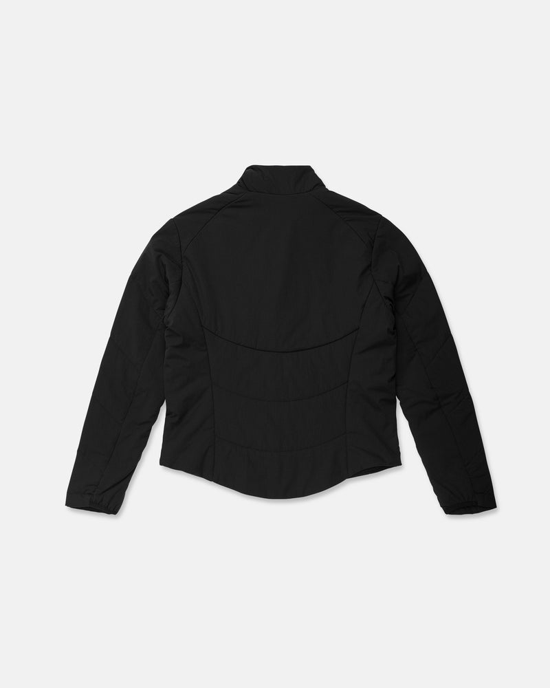 Back view of the Volcom Women’s Evergreen Full Zip Jacket in black, featuring long sleeves, a fitted waist, visible seam detailing, and a slightly curved hem, displayed on a plain white background.