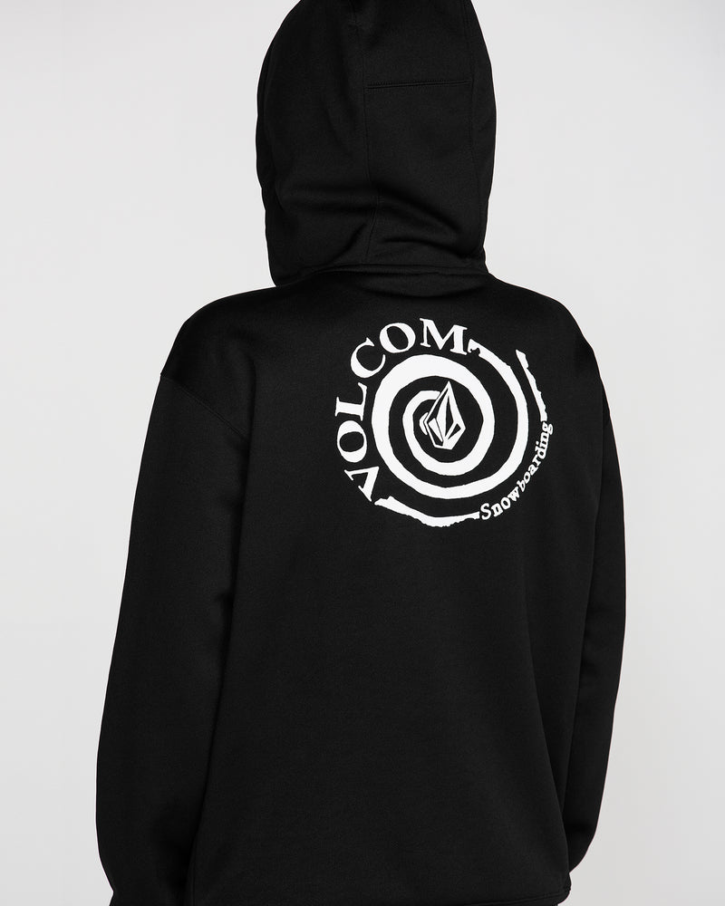 A person is facing away from the camera, wearing the Volcom Women’s Riding Hydro Pullover Hoodie in black, featuring a white circular Volcom Snowboarding logo on the back.