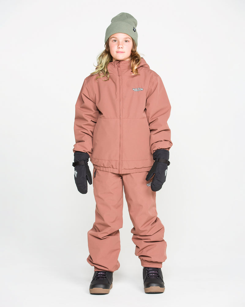 A person stands facing forward against a plain white background, ready for weather defense, wearing the Volcom Kids’ Youth Chaos Insulated Jacket in pinkish-brown with recycled insulation and matching pants, complemented by black gloves, black boots, and a gray beanie.