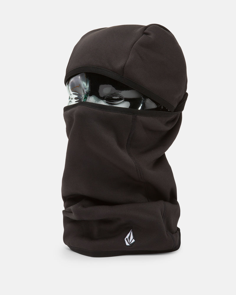 A black Volcom Men’s Face Pow pullover balaclava covers a glass mannequin head, leaving only the eyes exposed. The balaclava features a small white Volcom logo near the bottom edge.