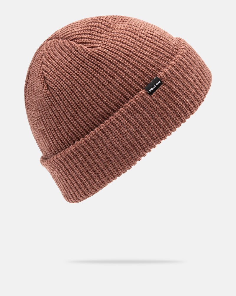 A Men’s Sweep Beanie by Volcom in pinkish-brown acrylic, featuring a folded brim and a small black rectangular tag, displayed on a white background.